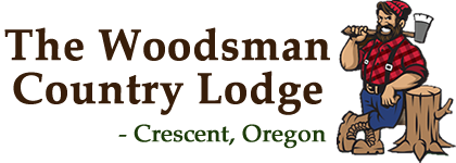 The Woodsman Country Lodge Logo